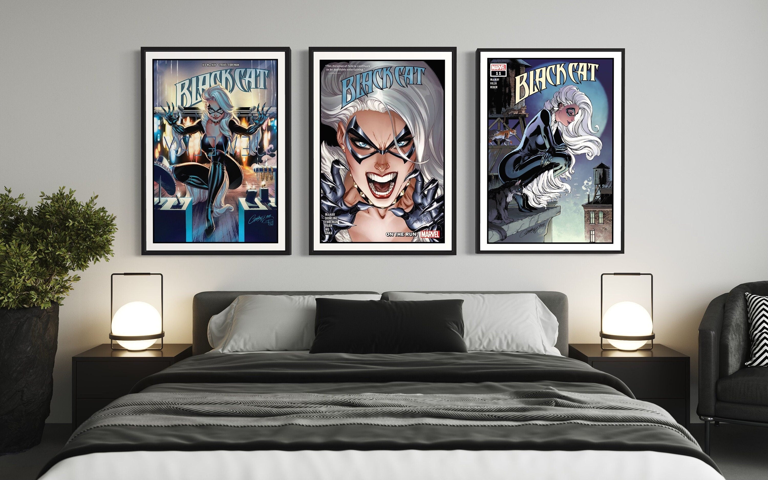 Set of 3 Black Cat comic cover prints showcasing vibrant artwork and dynamic poses of the character.