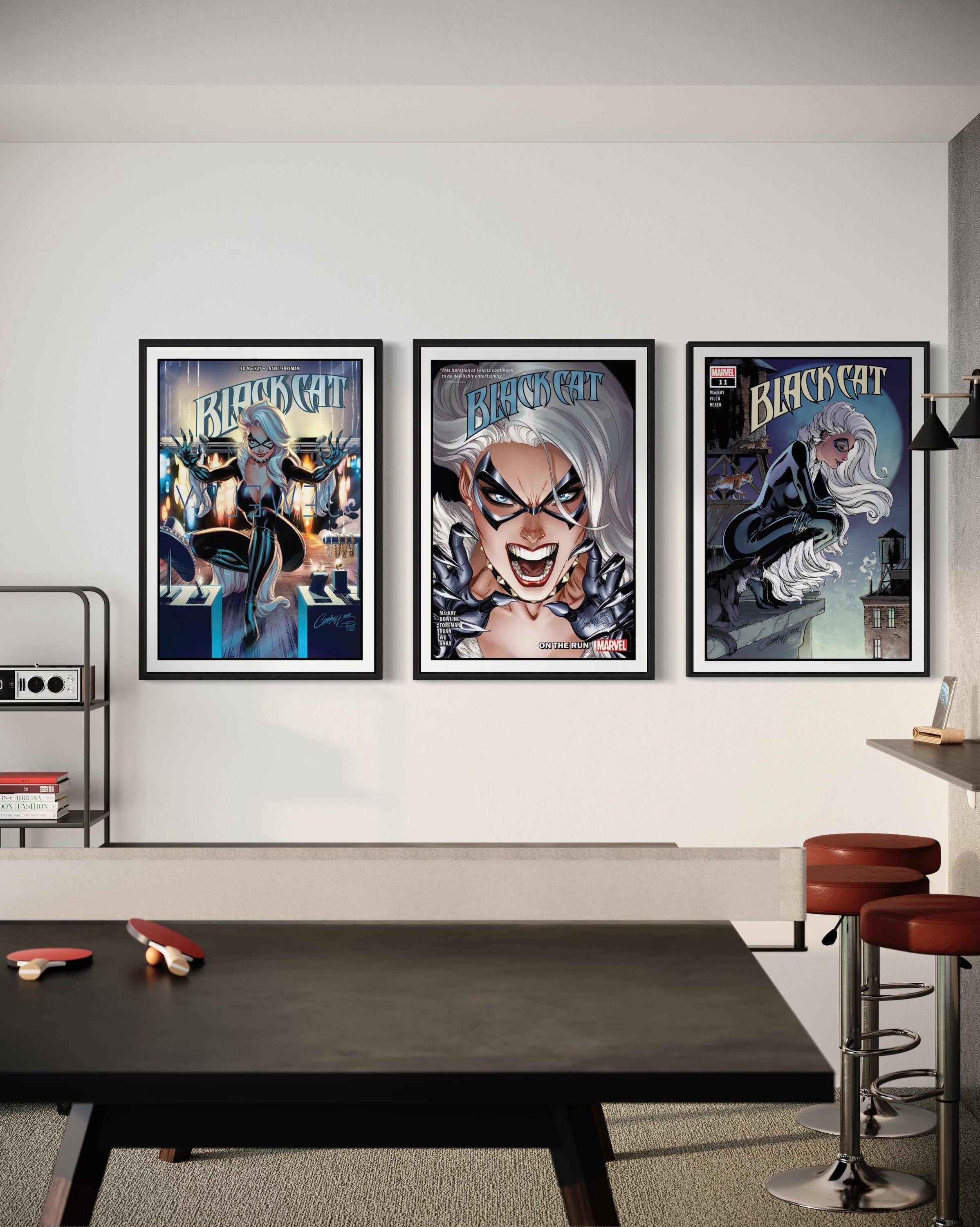 Set of 3 Black Cat comic cover prints showcasing vibrant artwork and dynamic poses of the character.