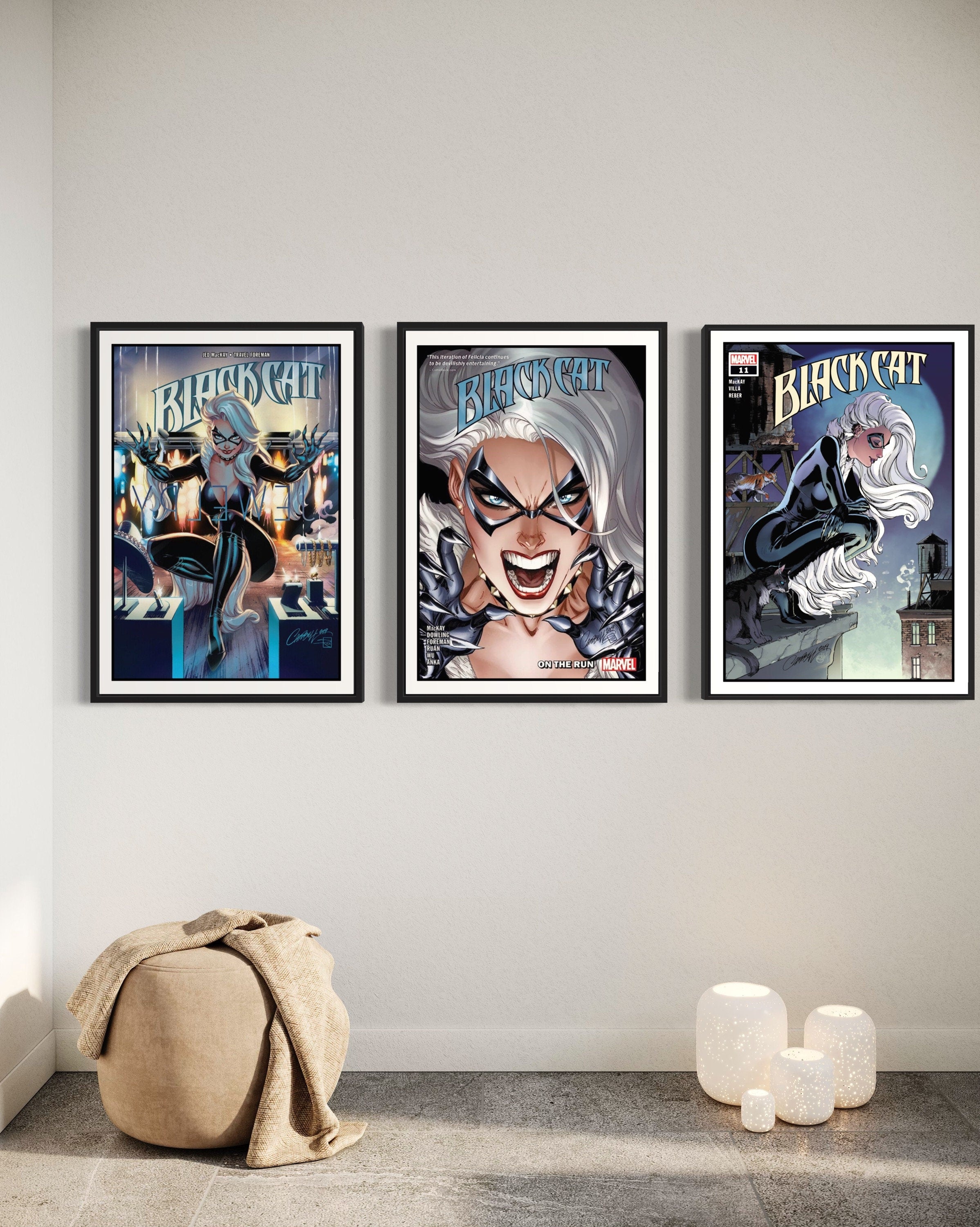 Set of 3 Black Cat comic cover prints showcasing vibrant artwork and dynamic poses of the character.