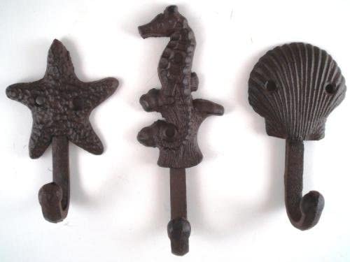 Set of 6 Nautical Cast Iron Wall Hooks featuring unique designs like Lighthouse, Dolphin, Anchor, Starfish, Seahorse, and Sea Shell.