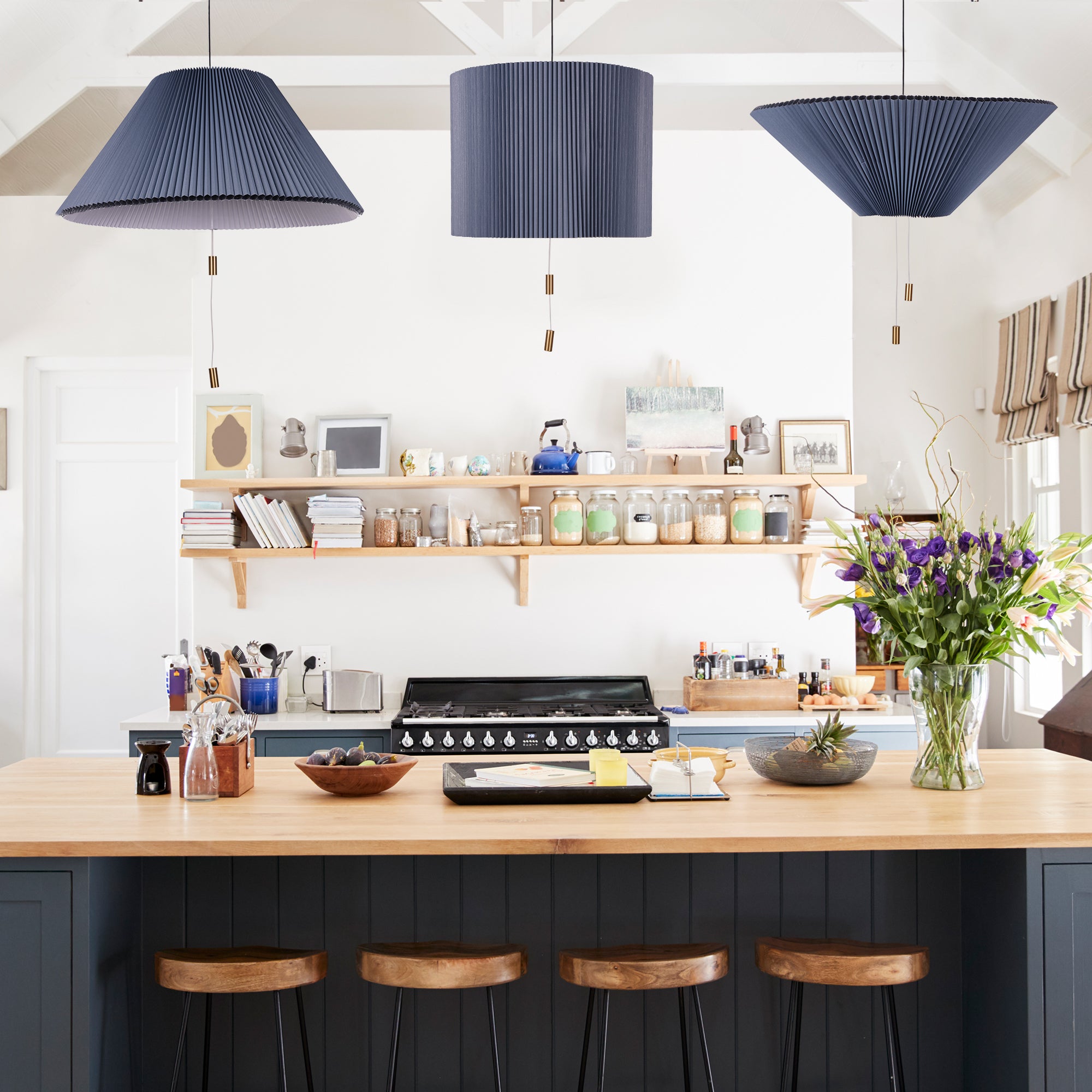 Shape Changing Pendant Lamp in blue, showcasing its adjustable origami-style design and elegant lighting.