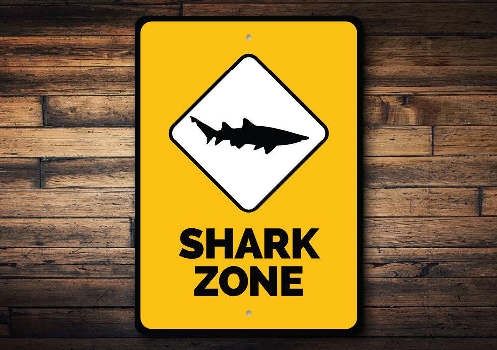 A vibrant Shark Zone Sign made of high-quality aluminum, featuring beach-themed graphics, perfect for coastal decor.