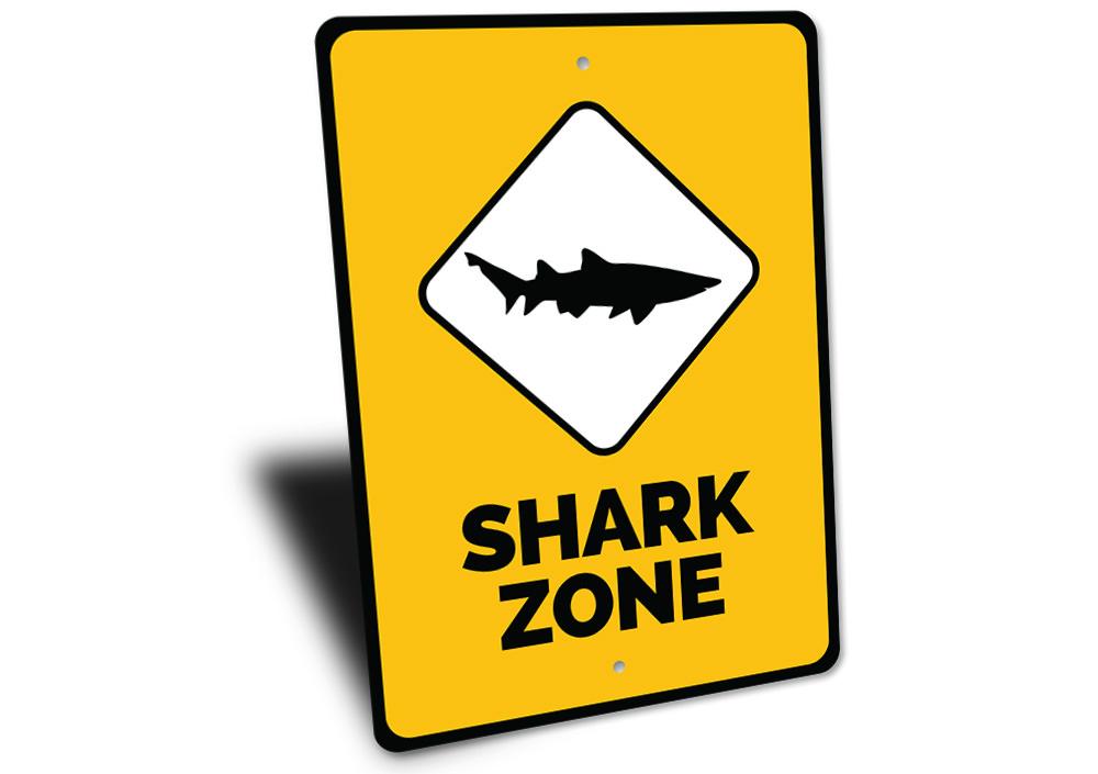 A vibrant Shark Zone Sign made of high-quality aluminum, featuring beach-themed graphics, perfect for coastal decor.