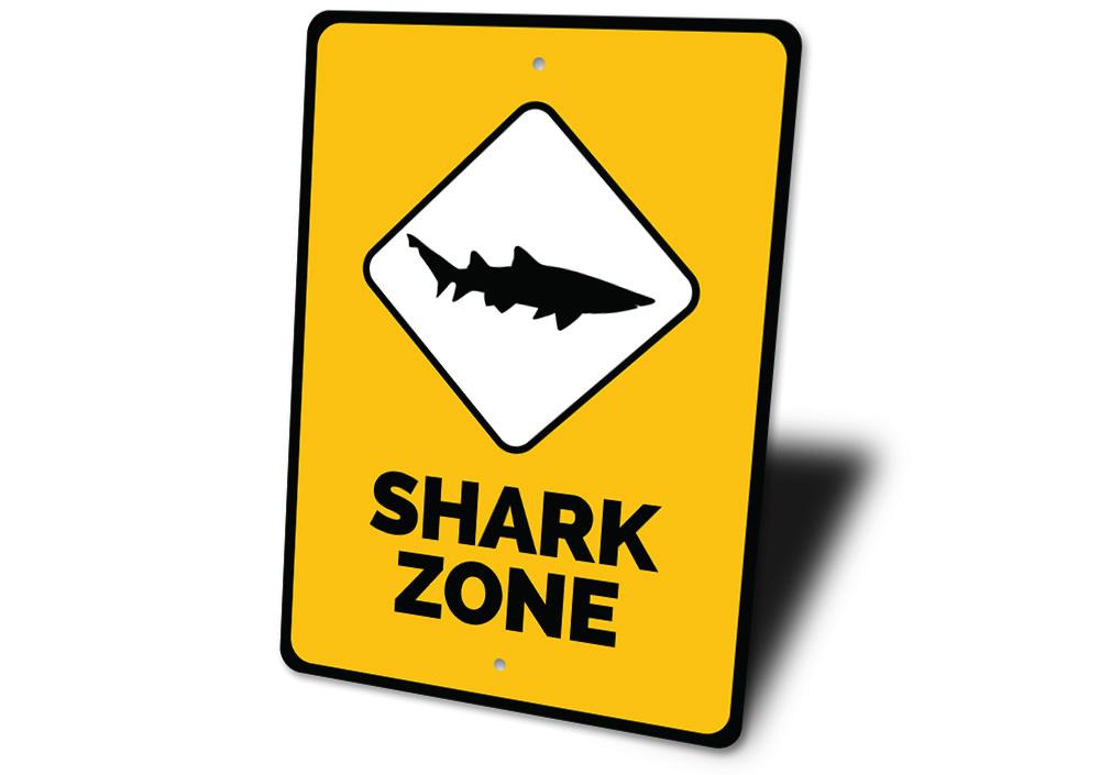 A vibrant Shark Zone Sign made of high-quality aluminum, featuring beach-themed graphics, perfect for coastal decor.