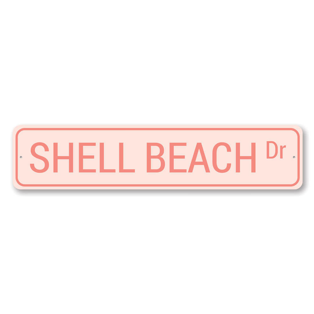 A decorative Shell Beach Drive Sign made of high-quality aluminum, featuring a coastal design perfect for beach houses and outdoor decor.