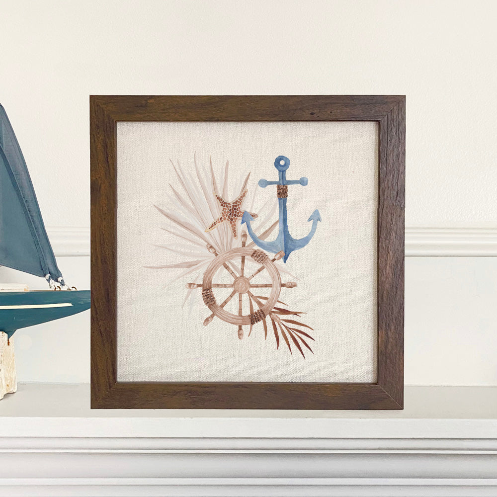 A beautifully framed Ship Wheel Anchor sign with a linen-look background, available in walnut and white-washed frame options.