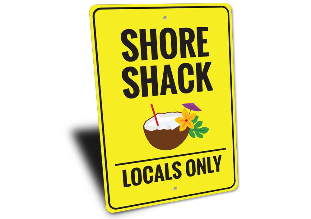 A vibrant Shore Shack Sign made of durable aluminum, featuring beach-themed graphics, perfect for coastal decor.