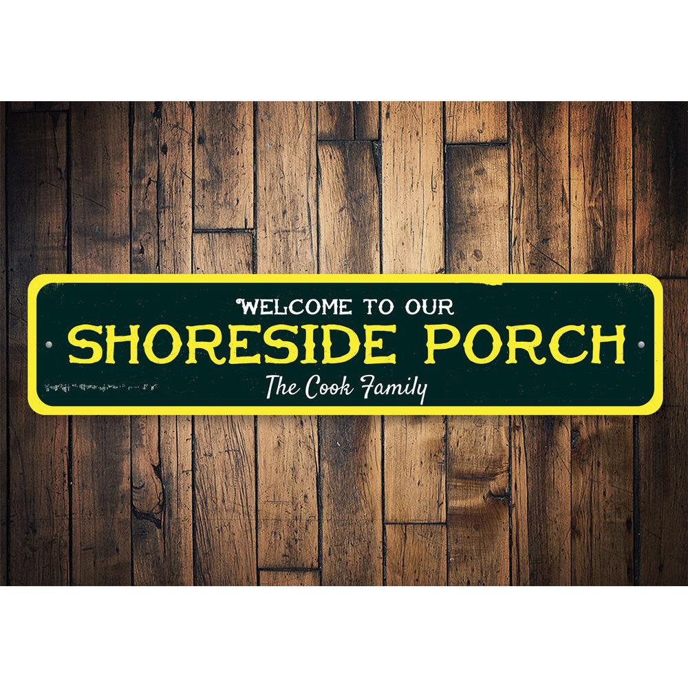 A beautifully crafted Shoreside Porch Sign made of aluminum, featuring beach-themed designs, perfect for coastal decor.