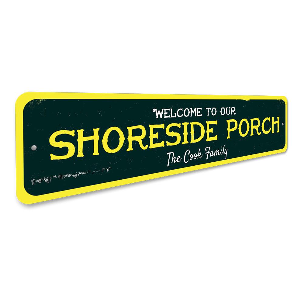 A beautifully crafted Shoreside Porch Sign made of aluminum, featuring beach-themed designs, perfect for coastal decor.