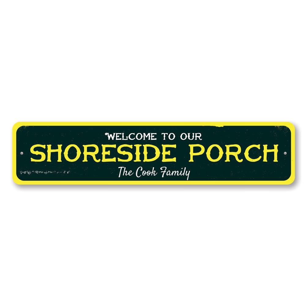 A beautifully crafted Shoreside Porch Sign made of aluminum, featuring beach-themed designs, perfect for coastal decor.