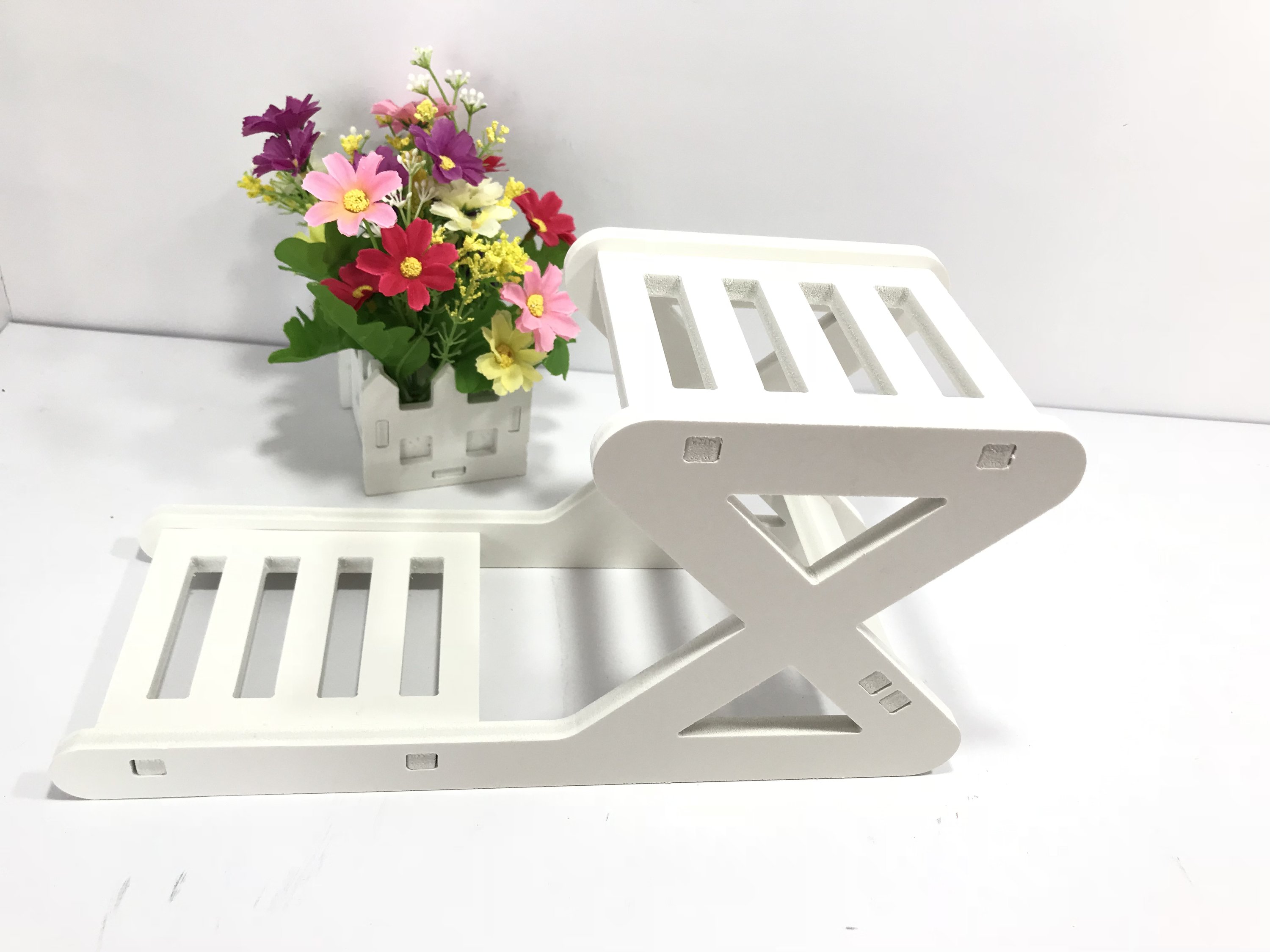 Showcase Floating Shelves in white, displaying plants and decorative items, perfect for home decor.