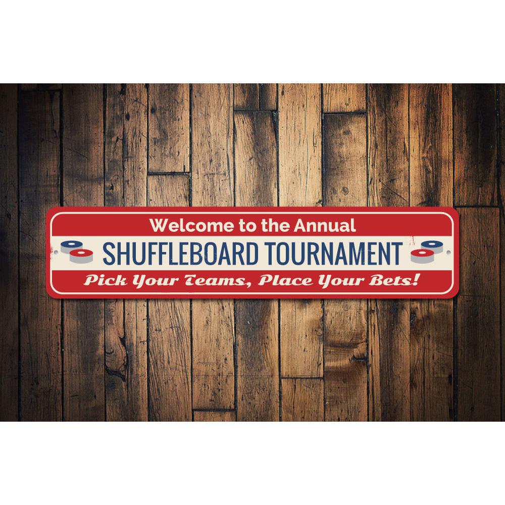 A decorative Shuffleboard Tournament Sign made of high-quality aluminum, featuring customizable text and pre-drilled holes for easy mounting.