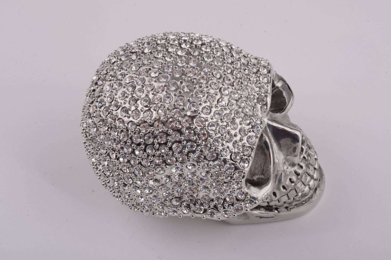 A beautifully crafted Silver Decorated Skull trinket box featuring intricate enamel painting and handpicked Austrian crystals, plated with 24K gold or 925 silver.