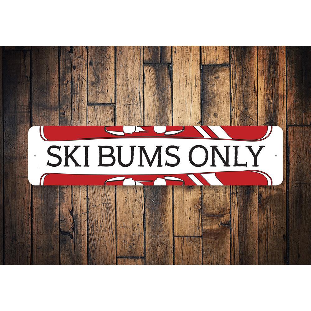 Ski Bums Only sign made of high-quality aluminum, featuring a fun and stylish design perfect for ski enthusiasts.