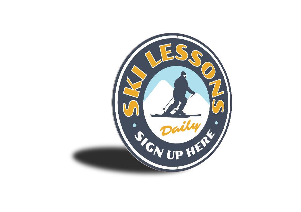 A decorative Ski Lessons Circle Sign made of high-quality aluminum, featuring a ski-themed design, perfect for wall decor in ski lodges or homes.