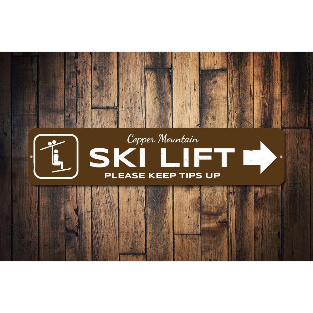 A decorative Ski Lift Directional Sign made of high-quality aluminum, featuring customizable text and pre-drilled holes for easy mounting.