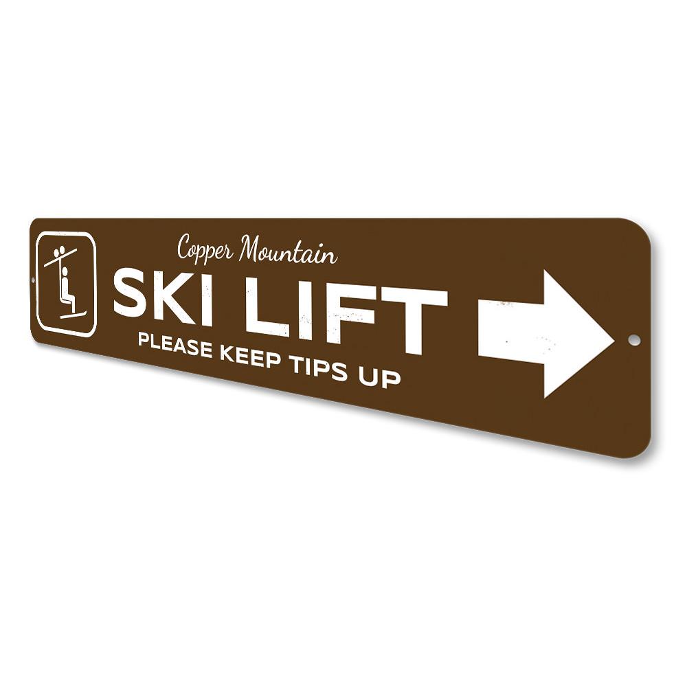 A decorative Ski Lift Directional Sign made of high-quality aluminum, featuring customizable text and pre-drilled holes for easy mounting.