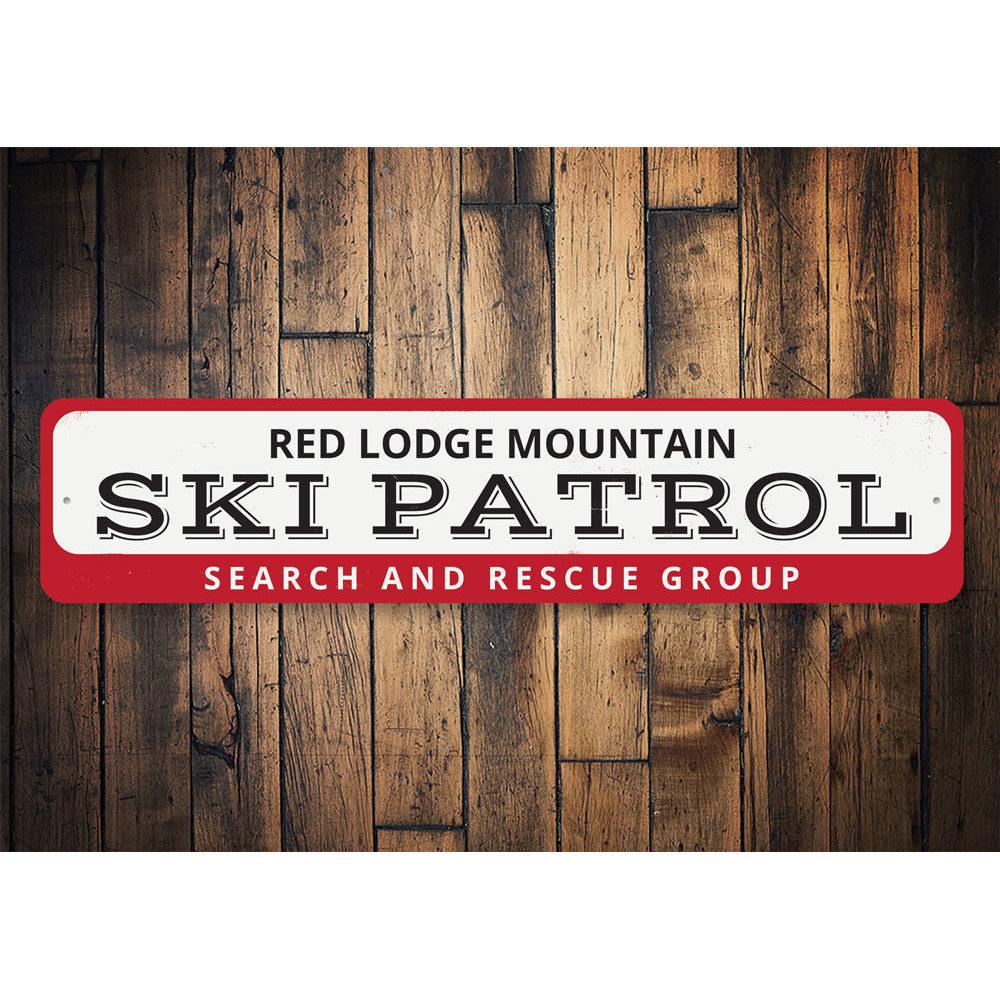 Ski Patrol Mountain Sign made of high-quality aluminum, featuring a decorative design perfect for ski lovers, mounted on a wall.