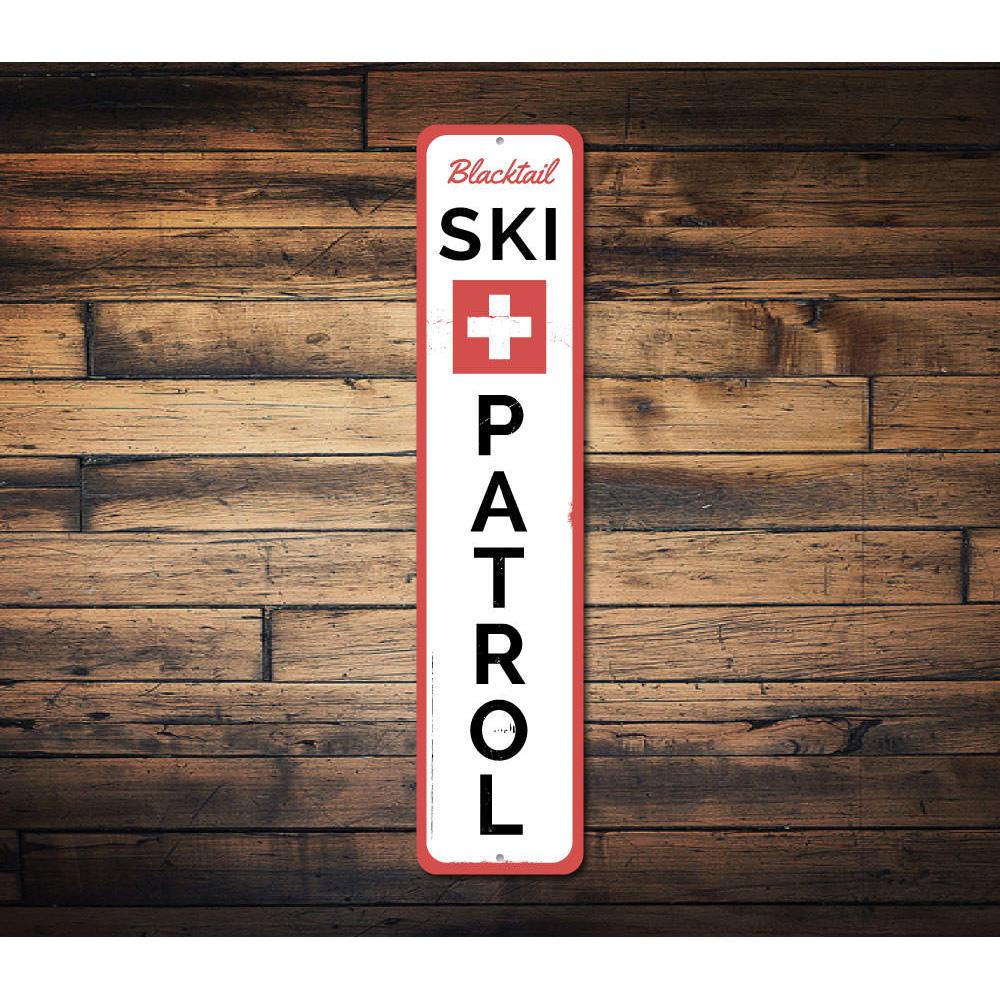 Ski Patrol Vertical Sign made of high-quality aluminum, featuring a vibrant design perfect for ski enthusiasts and lodge decor.