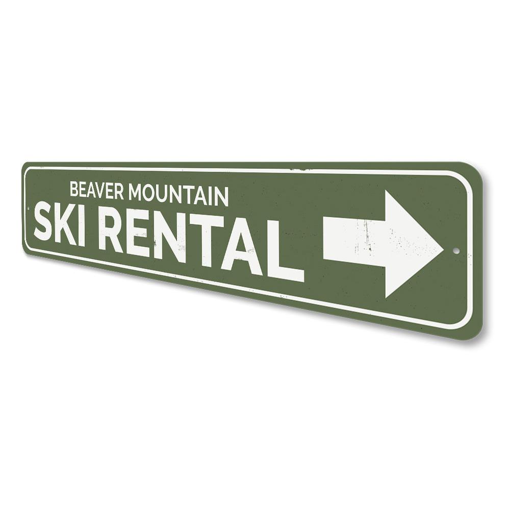 A decorative Ski Rental Arrow Sign made of aluminum, featuring customizable text, ideal for ski lodges and enthusiasts.