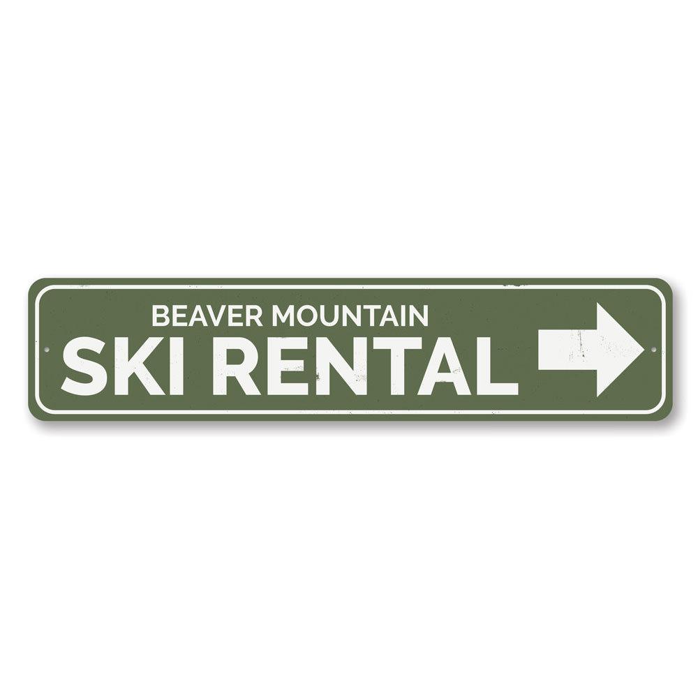 A decorative Ski Rental Arrow Sign made of aluminum, featuring customizable text, ideal for ski lodges and enthusiasts.