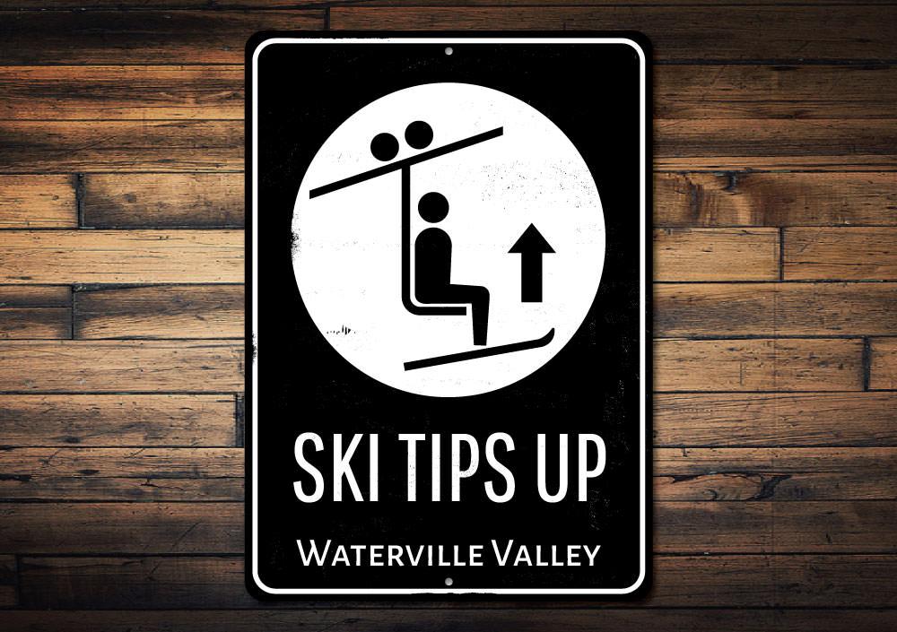 Ski Tips Up Destination Sign made of durable aluminum, featuring a ski-themed design perfect for lodge decor.