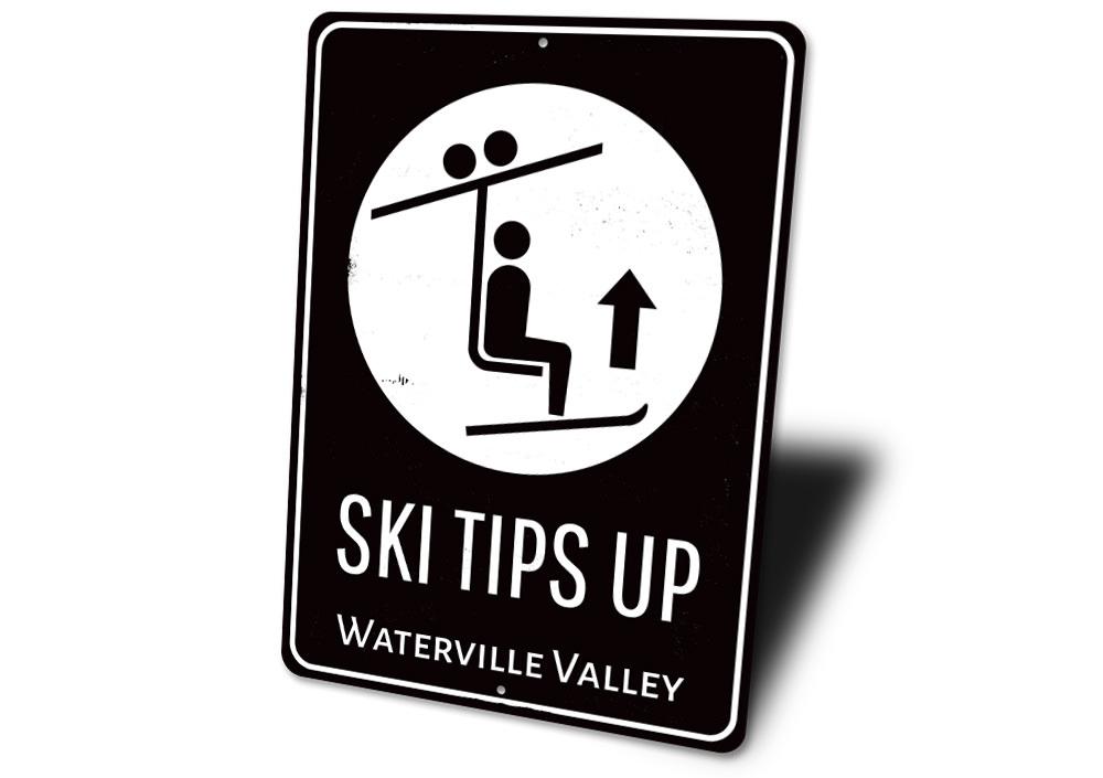 Ski Tips Up Destination Sign made of durable aluminum, featuring a ski-themed design perfect for lodge decor.