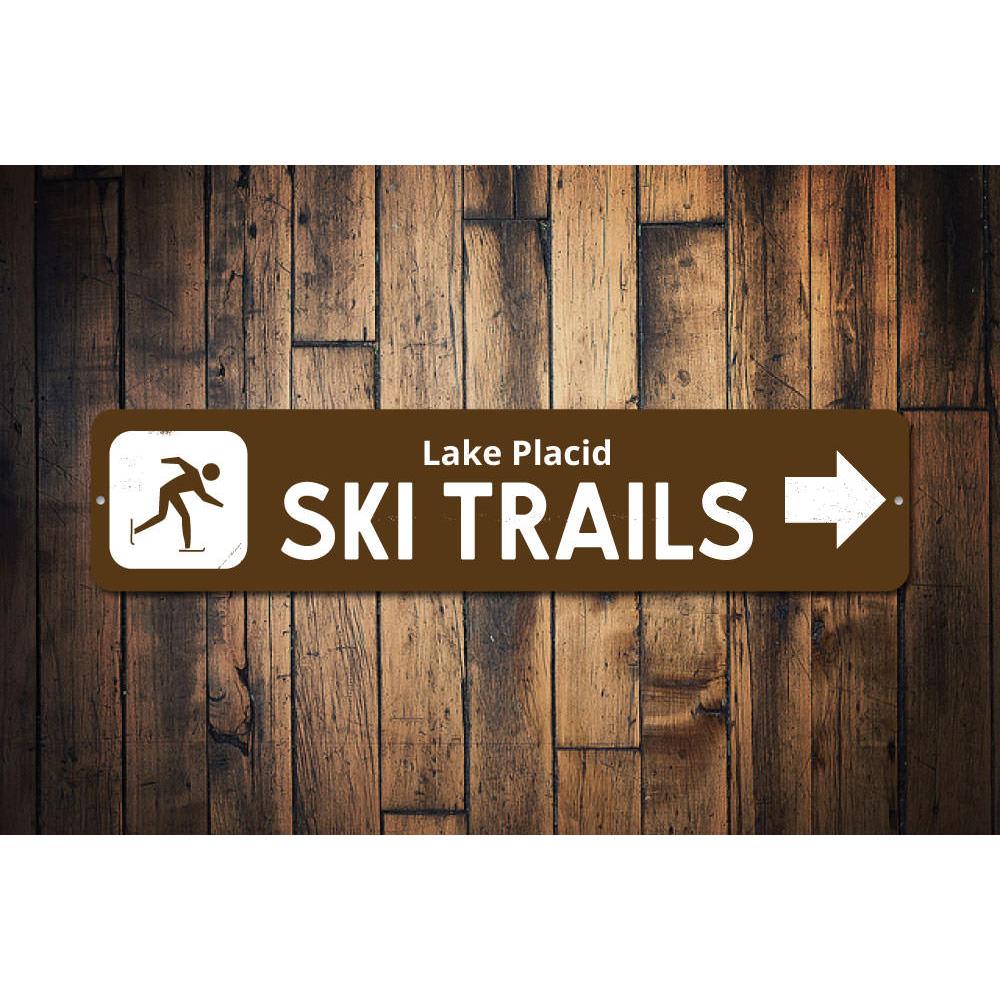 Ski Trails Arrow Sign made of durable aluminum, featuring customizable text and pre-drilled holes for easy mounting, perfect for lakehouse decor.