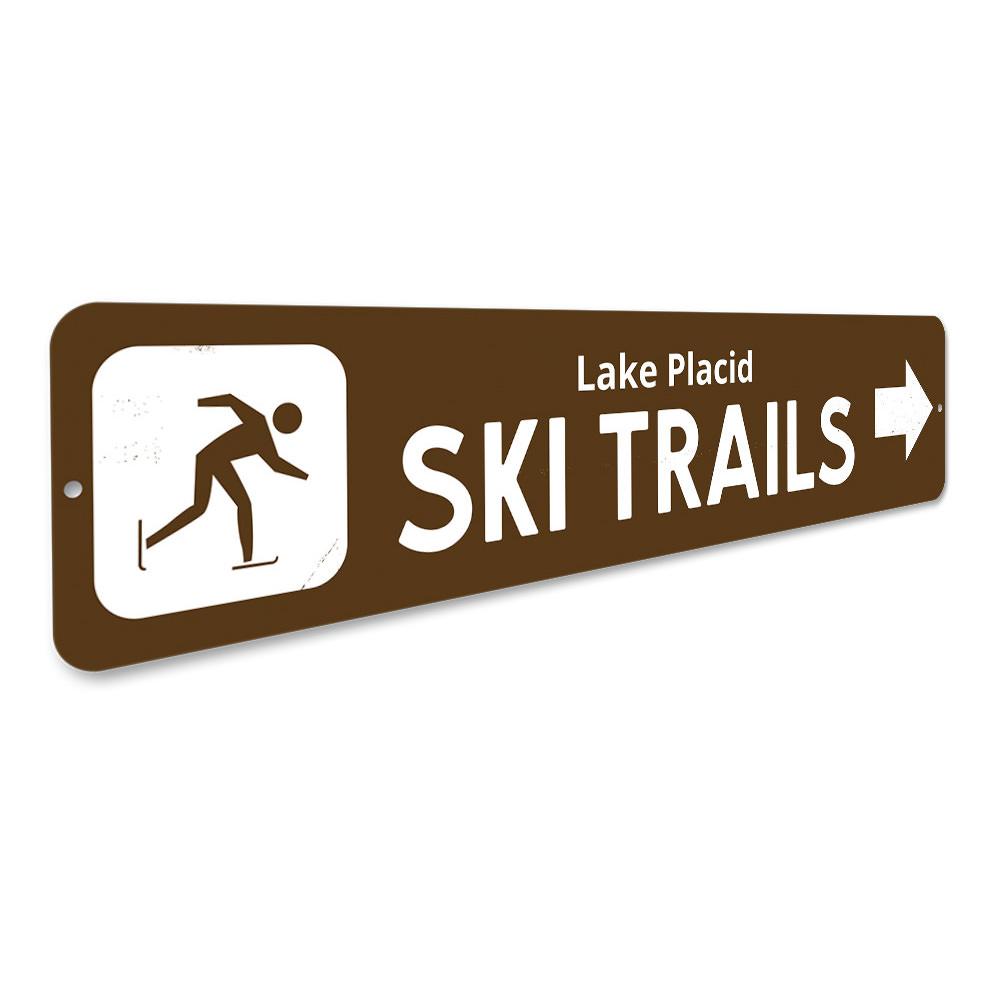 Ski Trails Arrow Sign made of durable aluminum, featuring customizable text and pre-drilled holes for easy mounting, perfect for lakehouse decor.