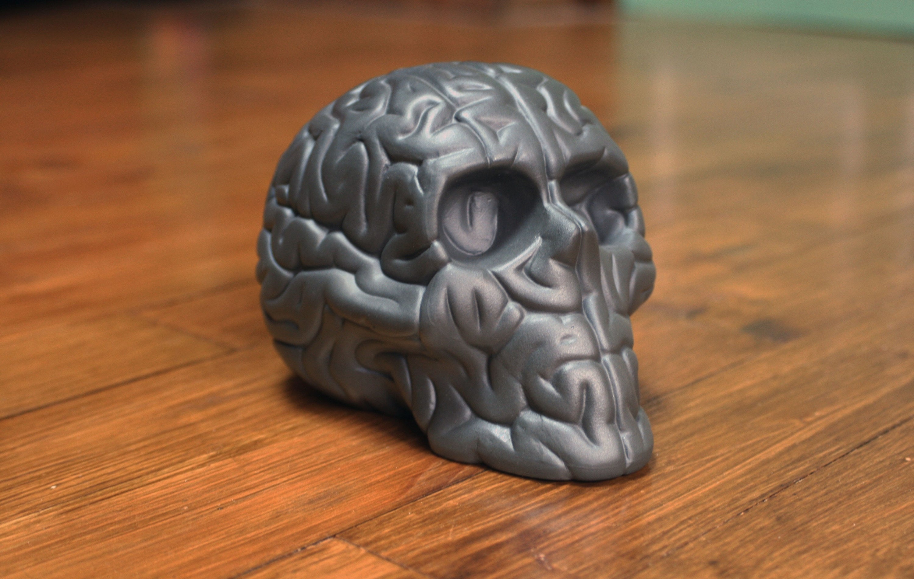 Skull Brain 'BLACK' sculpture by Emilio Garcia, crafted from black porcelain, showcasing a unique artistic design.