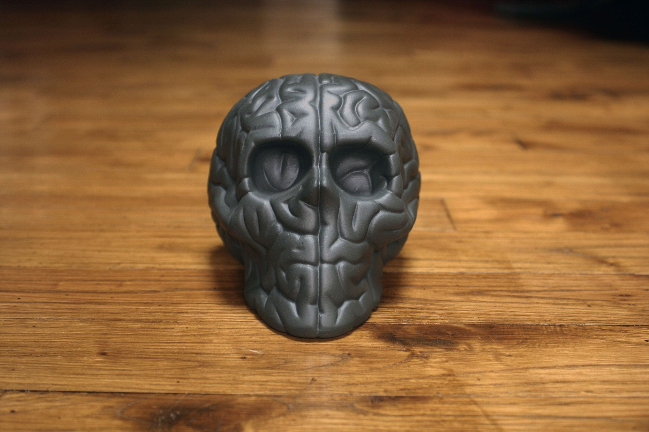 Skull Brain 'BLACK' sculpture by Emilio Garcia, crafted from black porcelain, showcasing a unique artistic design.