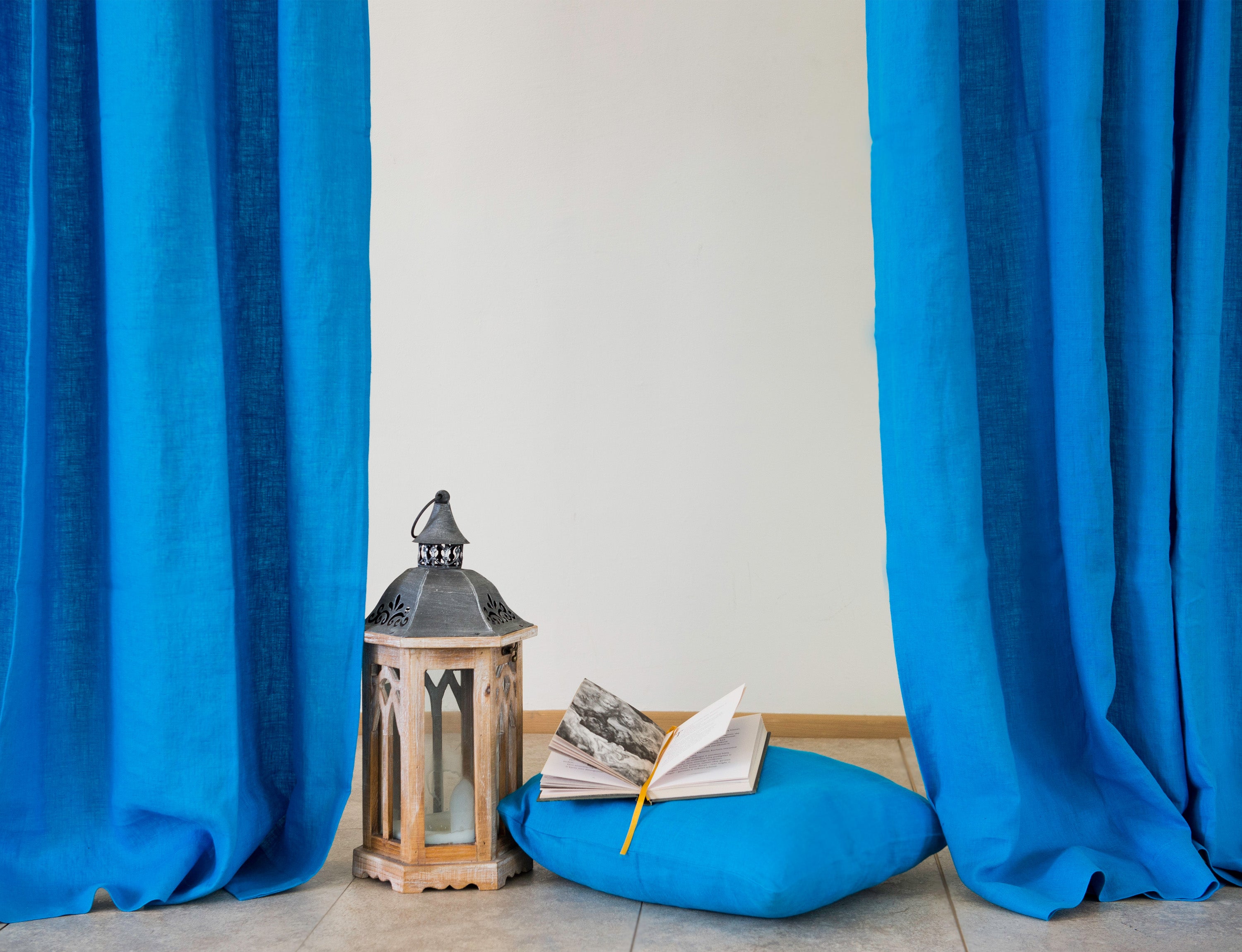 Sky Blue linen curtain with tab tops, showcasing a modern design and semi-sheer fabric.