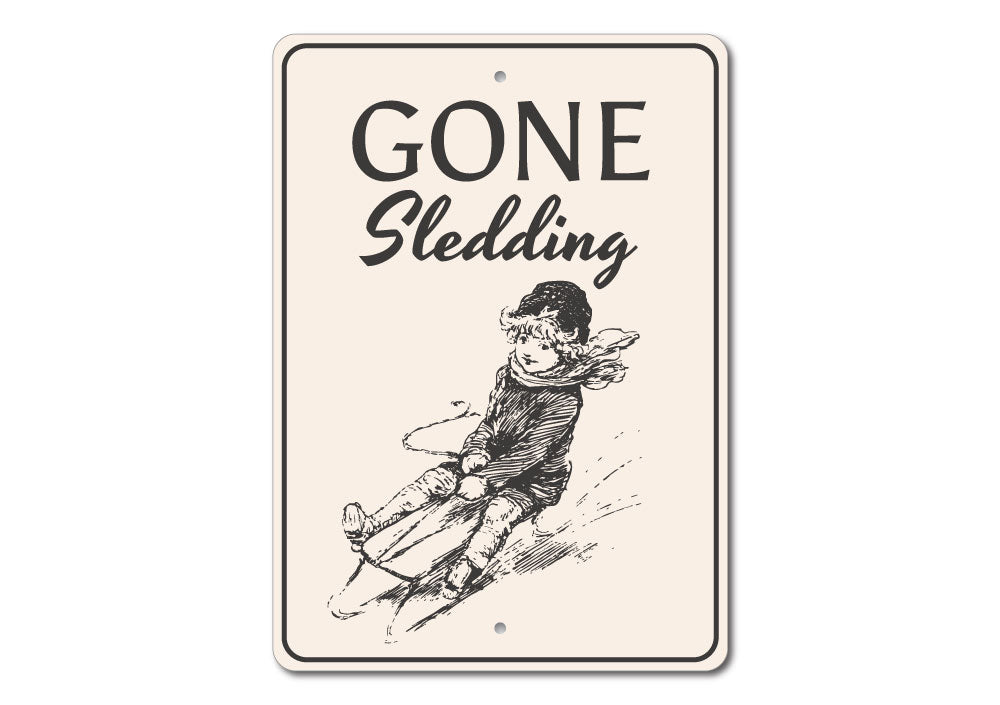 A festive Sledding Sign featuring cheerful winter imagery, perfect for Christmas decorations.