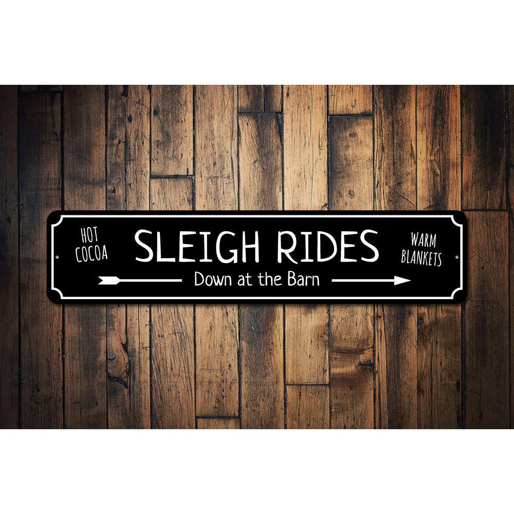 A festive Sleigh Rides Sign made of durable aluminum, featuring vibrant holiday colors and a charming design, perfect for Christmas decorations.