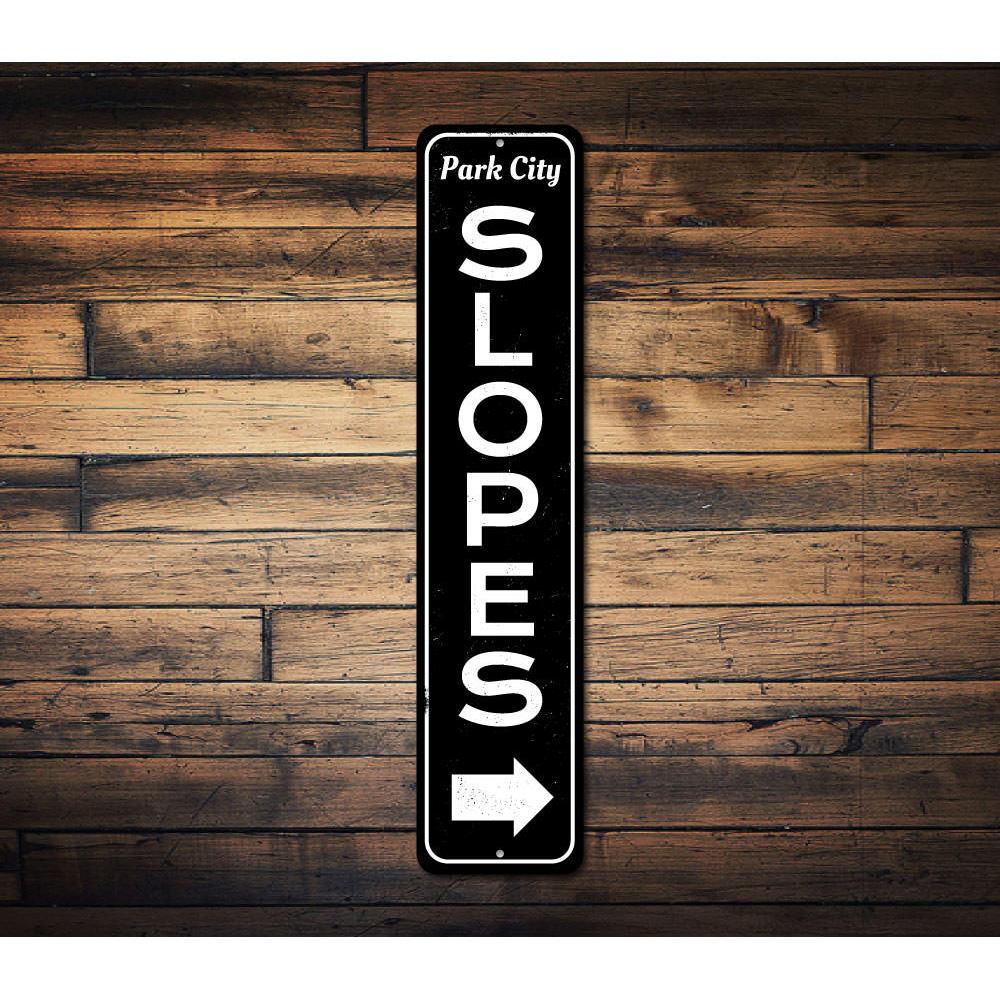 Slopes Arrow Vertical Sign made of high-quality aluminum, featuring a ski-themed design perfect for home decor.