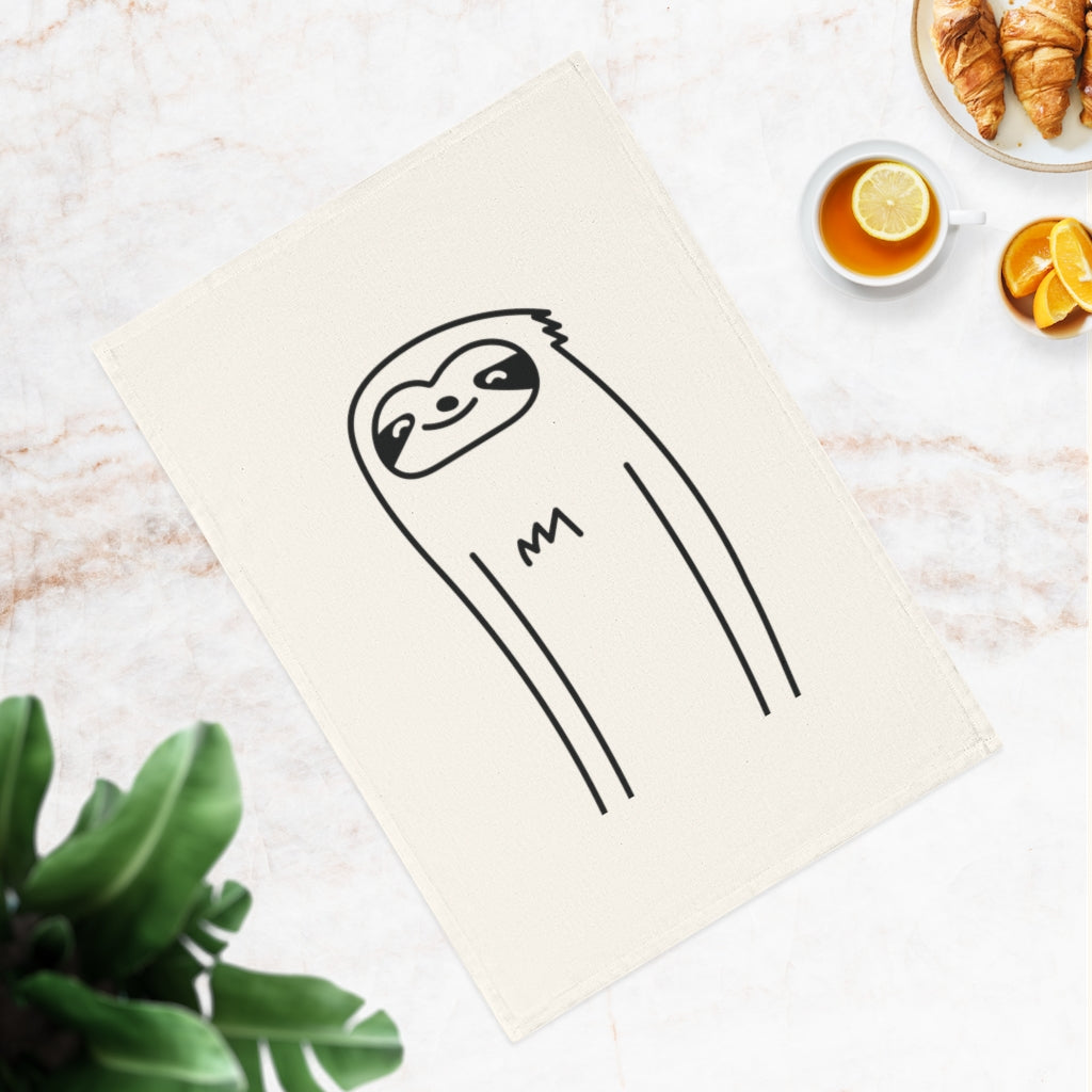 A cute sloth printed on a soft, organic cotton tea towel, measuring 50 x 70 cm, perfect for kitchen decor.