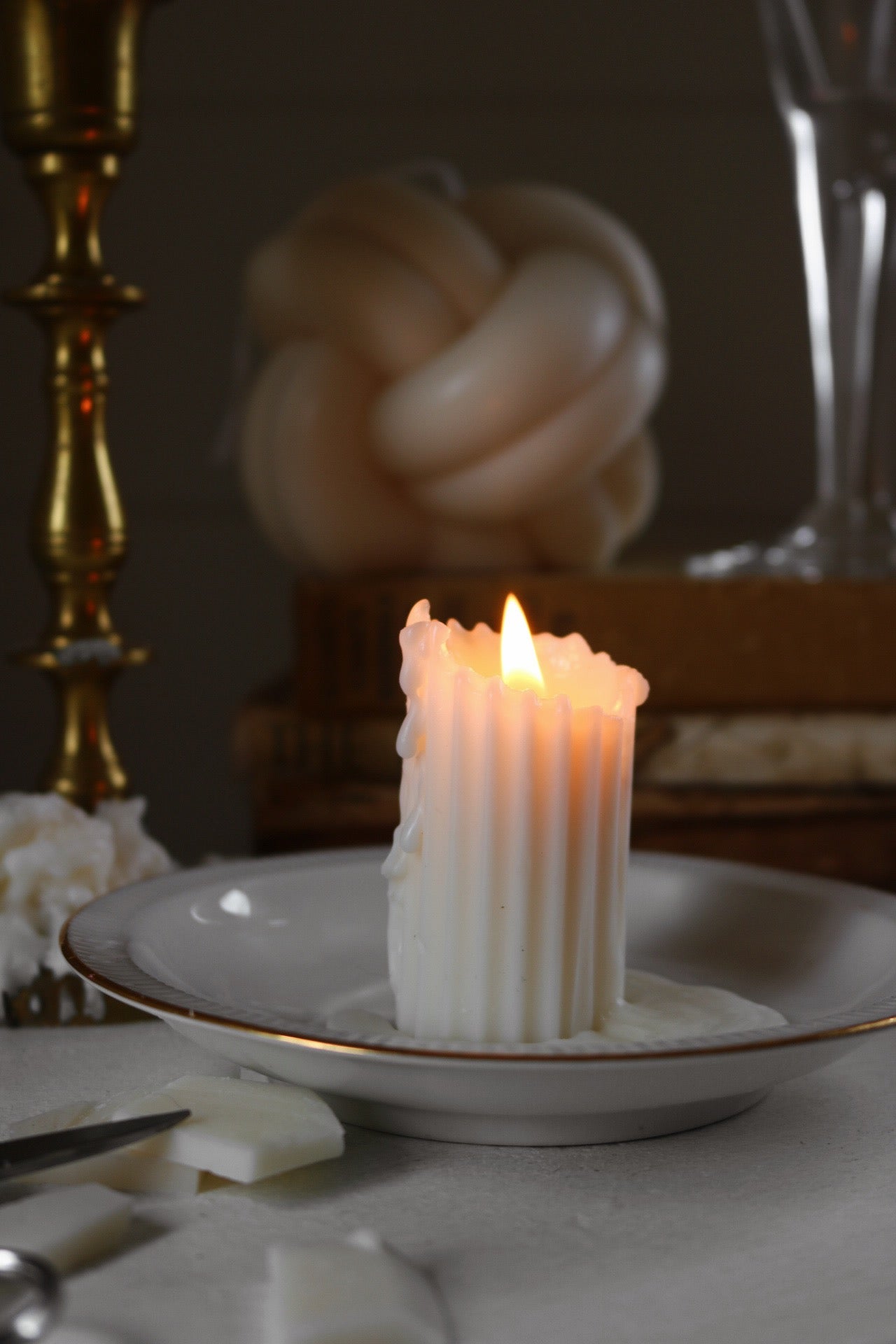 Small ribbed candlestick made from soy wax blend, showcasing a textured design, perfect for home decor.