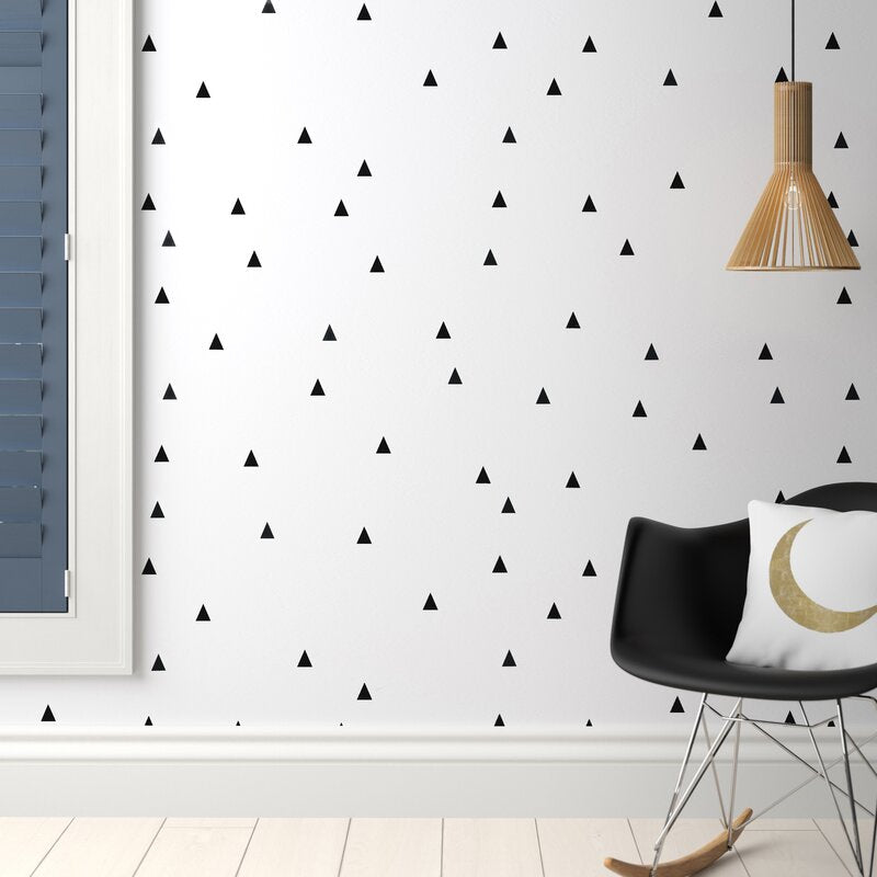 A collection of small triangle wall decals in black and gray, perfect for modern nursery and home decor.