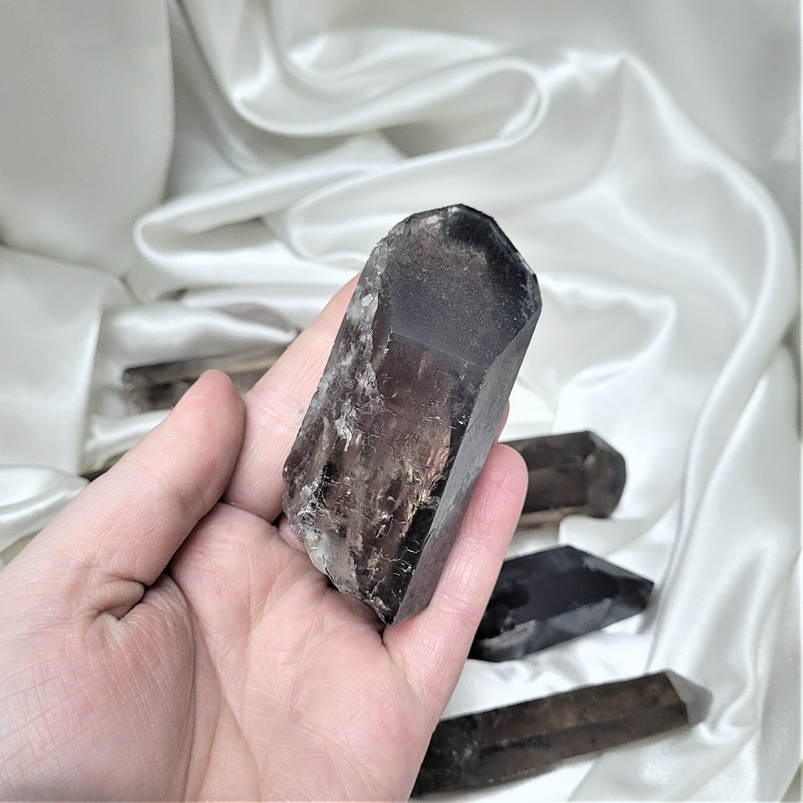 A collection of Smoky Quartz Raw Points showcasing their unique shapes and natural imperfections, perfect for meditation and energy work.