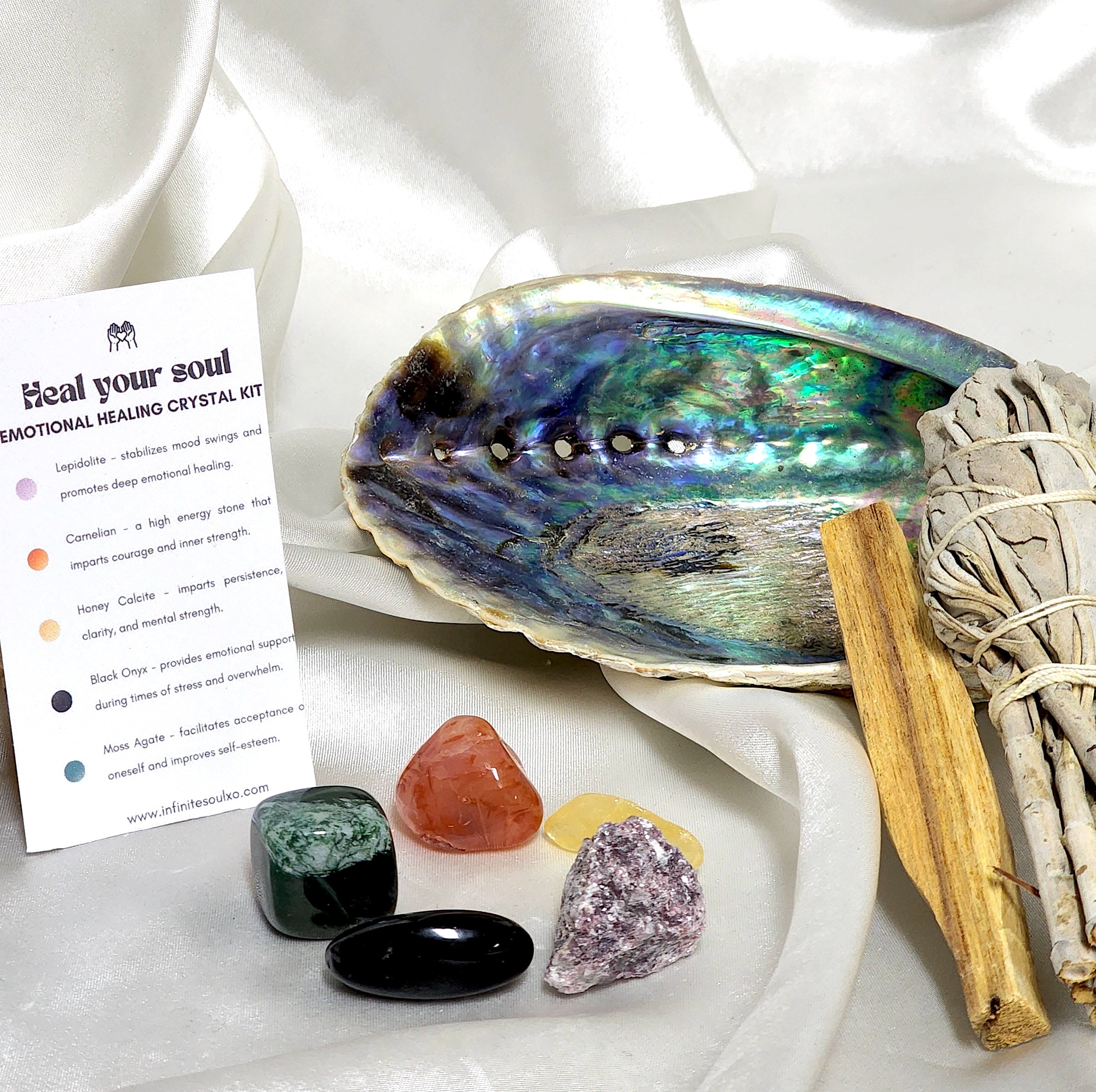 Smudge Kit: Heal Your Soul featuring sage smudge stick, Palo Santo, abalone shell, and various healing crystals for emotional healing.