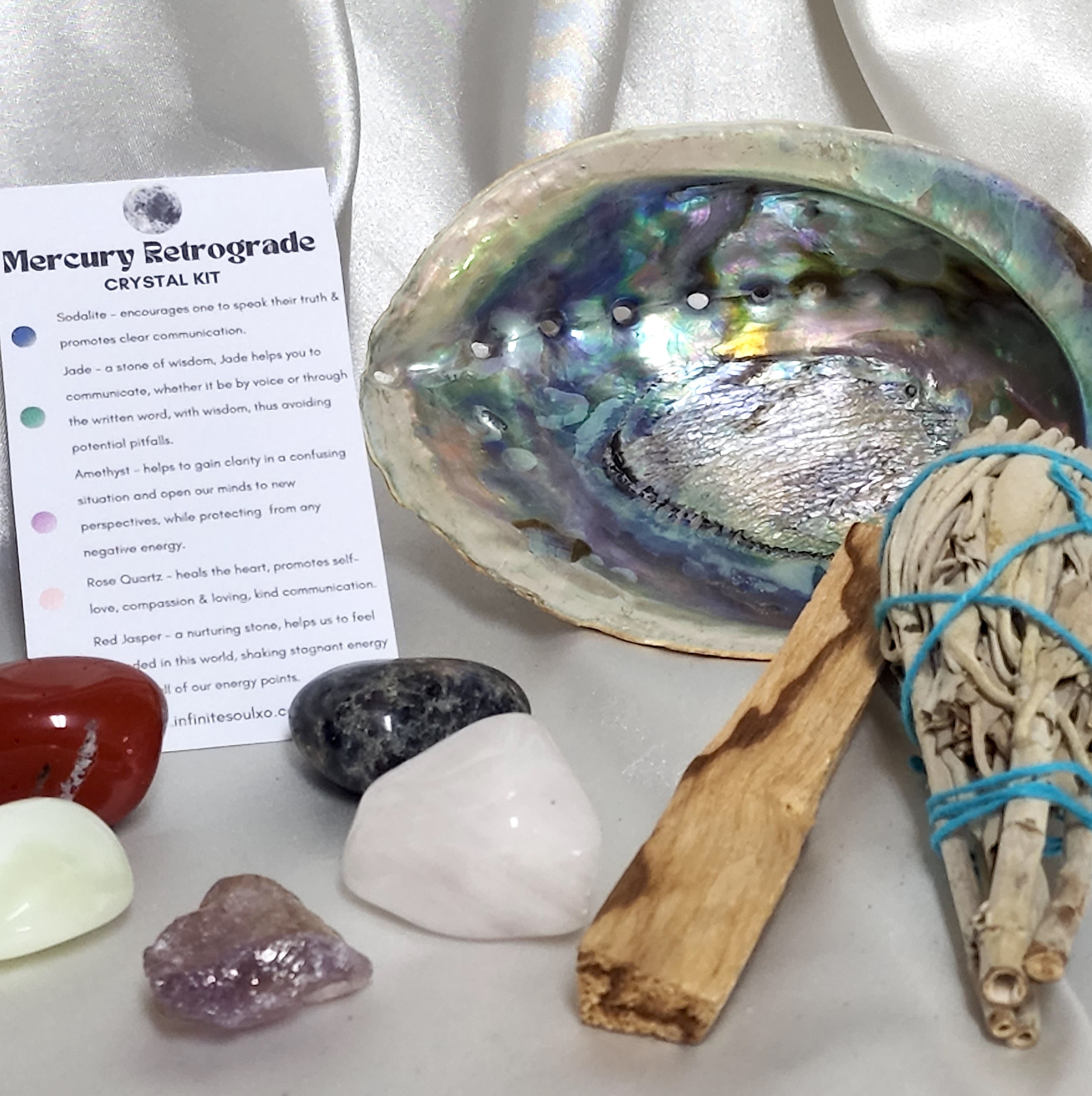 Smudge Kit for Mercury Retrograde featuring a large sage smudge stick, Palo Santo, and an abalone shell, ideal for cleansing rituals.