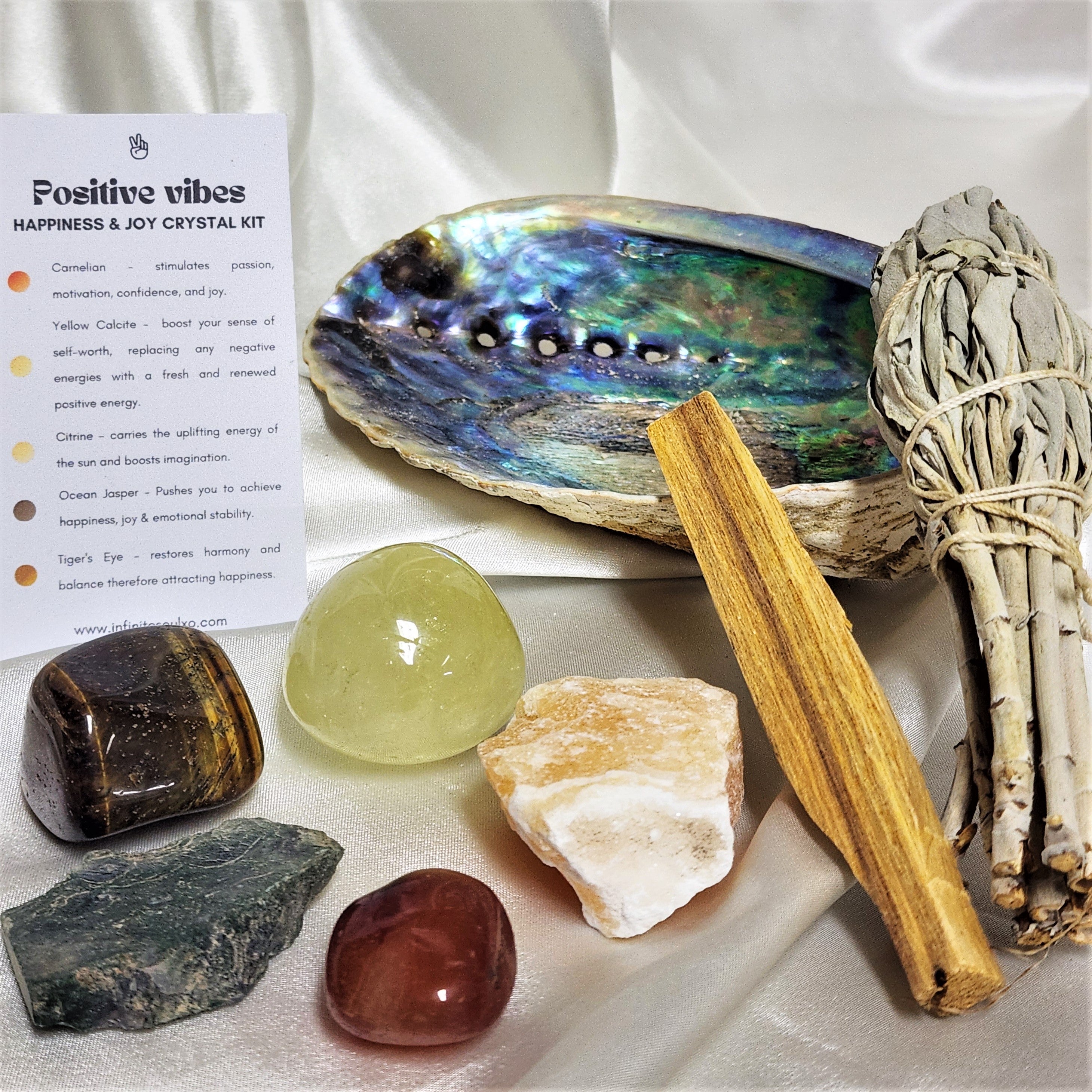 Happiness & Joy Smudge Kit featuring sage, palo santo, abalone shell, and five unique crystals for positive energy.