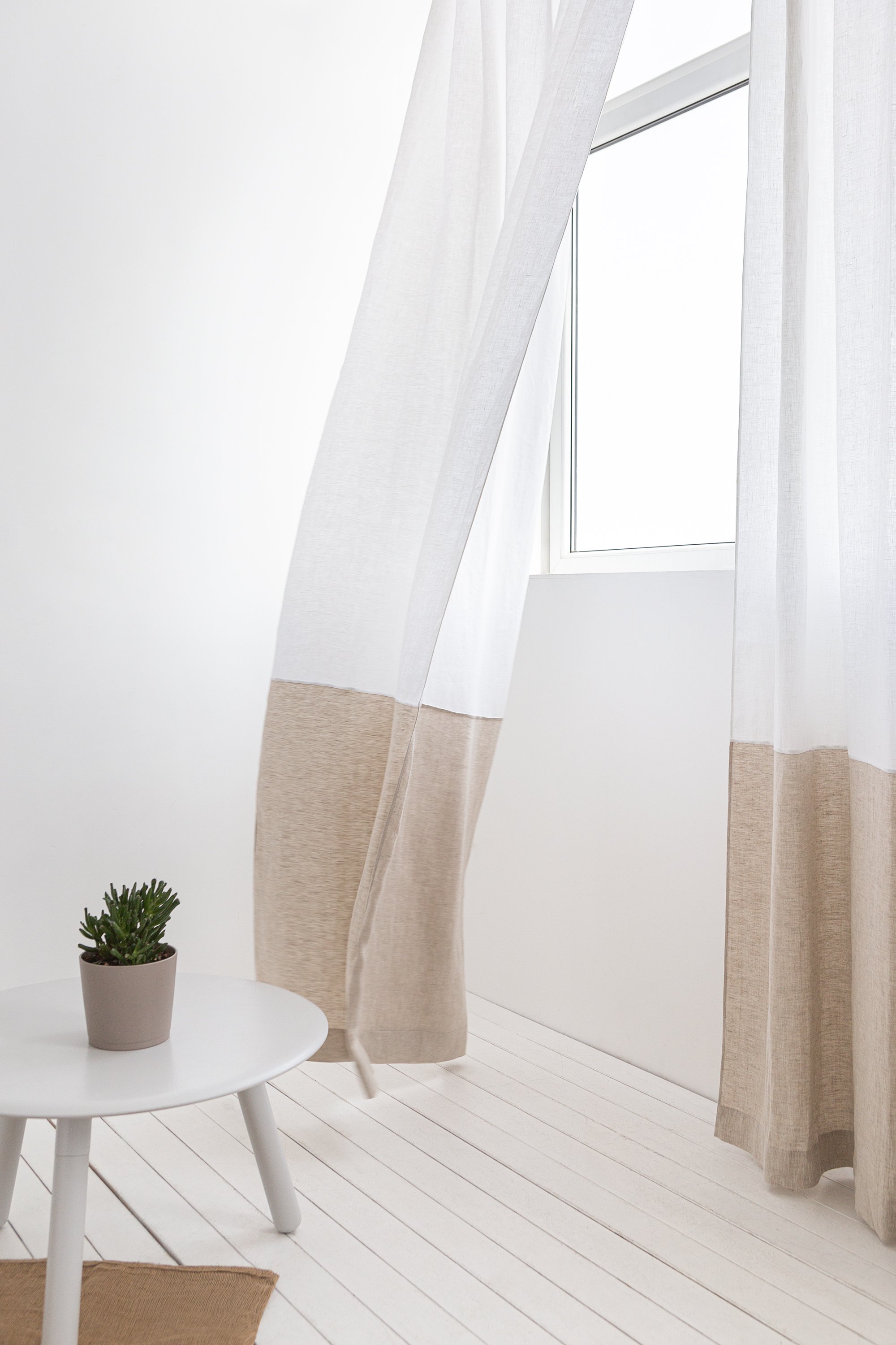 Elegant Snow White and Grey linen curtains with multifunctional tape heading, showcasing a modern two-tone design in a bright room.