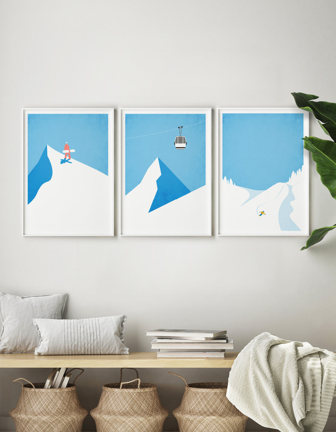 A collection of three minimalistic snowboard posters arranged for a gallery wall display, showcasing winter sports themes.