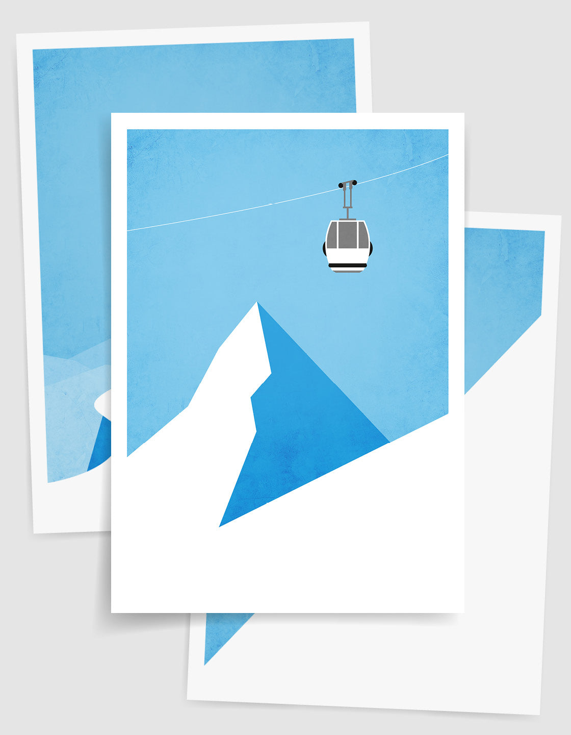 A minimalist art set of 3 posters featuring a snowboarder on a peak, a ski gondola against a blue sky, and a boarder riding powder on a mountainside.