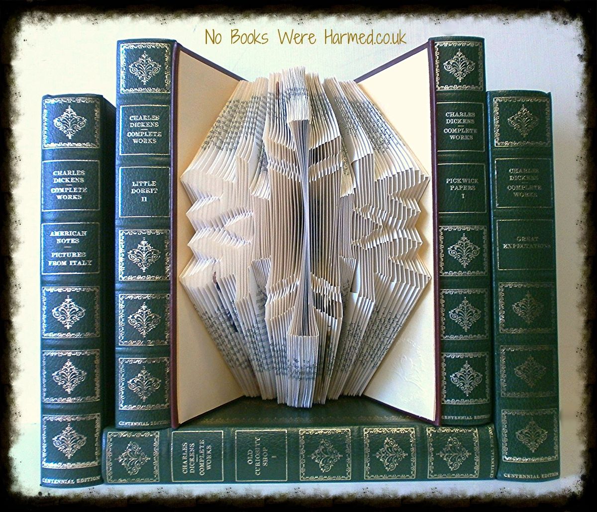 Handcrafted Snowflake art piece made from vintage books, showcasing intricate folds and unique design.