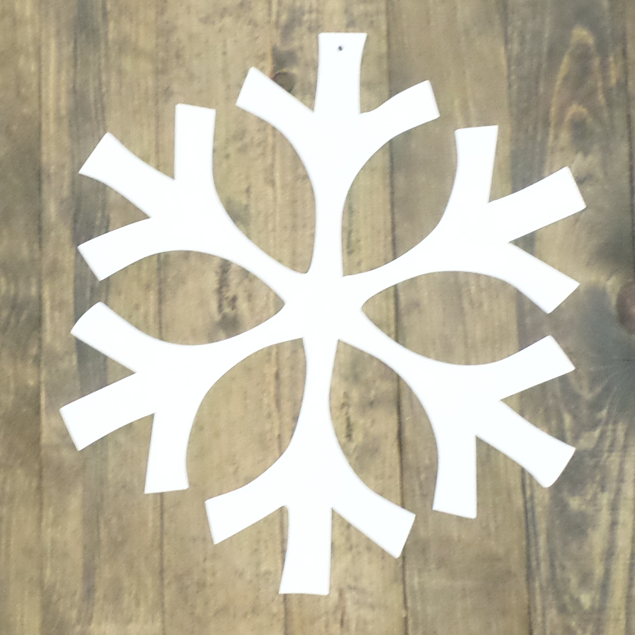 Snowflake Needle metal wall art featuring intricate snowflake design, crafted from high-quality steel with a low gloss powder coating.