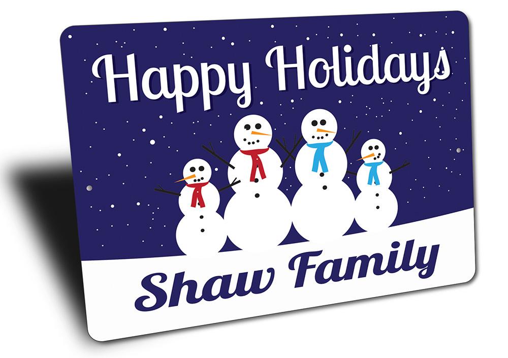 A festive Snowmen Sign featuring cheerful snowmen in a winter scene, perfect for Christmas decorations.