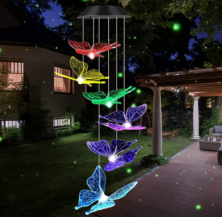 Colorful Solar Power Butterfly Wind Chimes hanging outdoors, featuring six butterfly designs and vibrant LED lights.