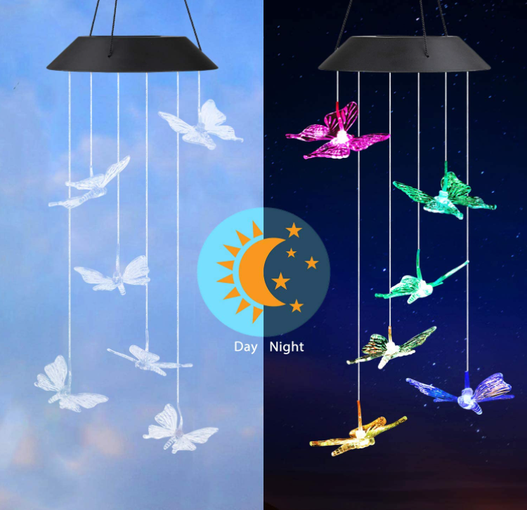 Colorful Solar Power Butterfly Wind Chimes hanging outdoors, featuring six butterfly designs and vibrant LED lights.